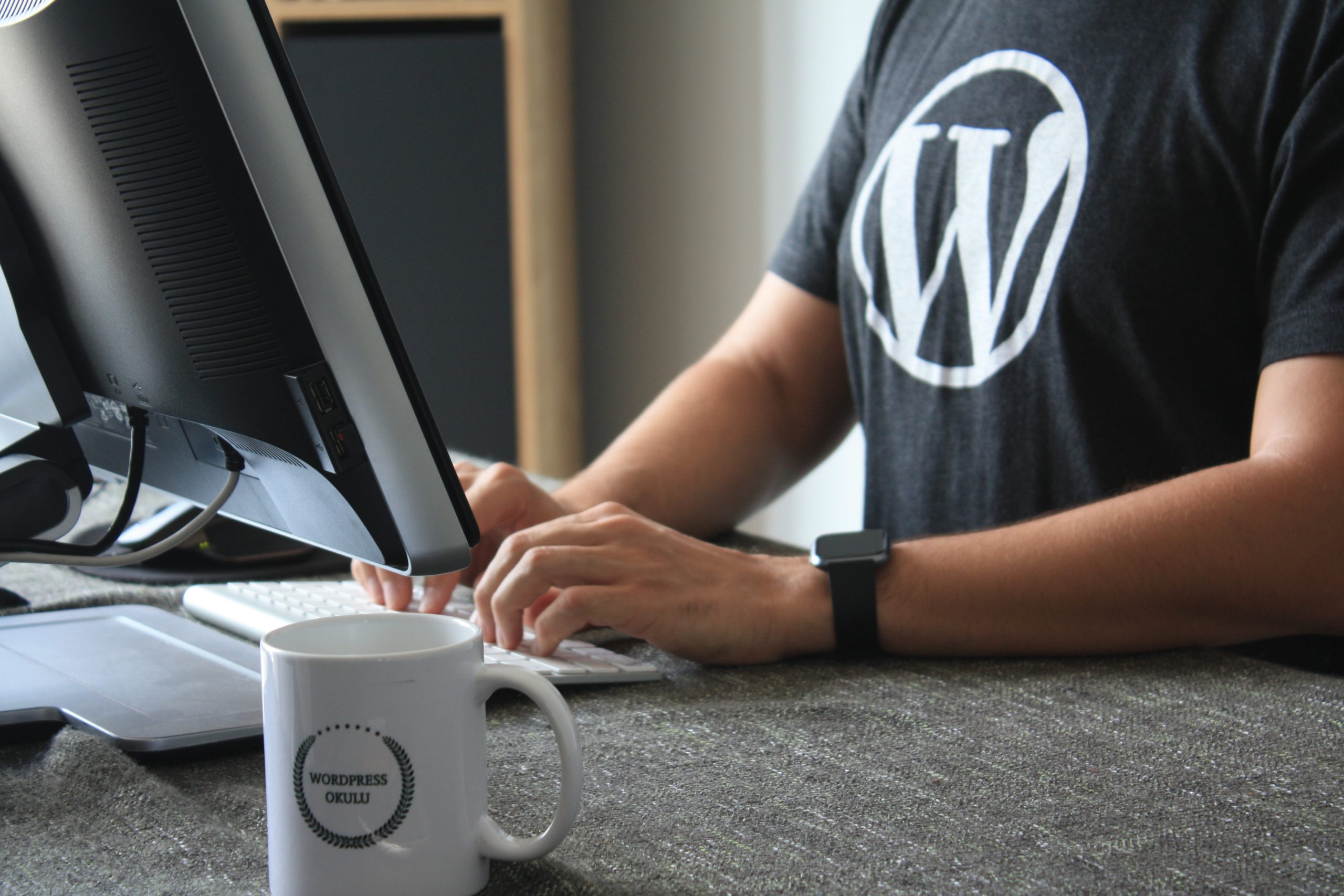 man in a t-shirt working in wordpress